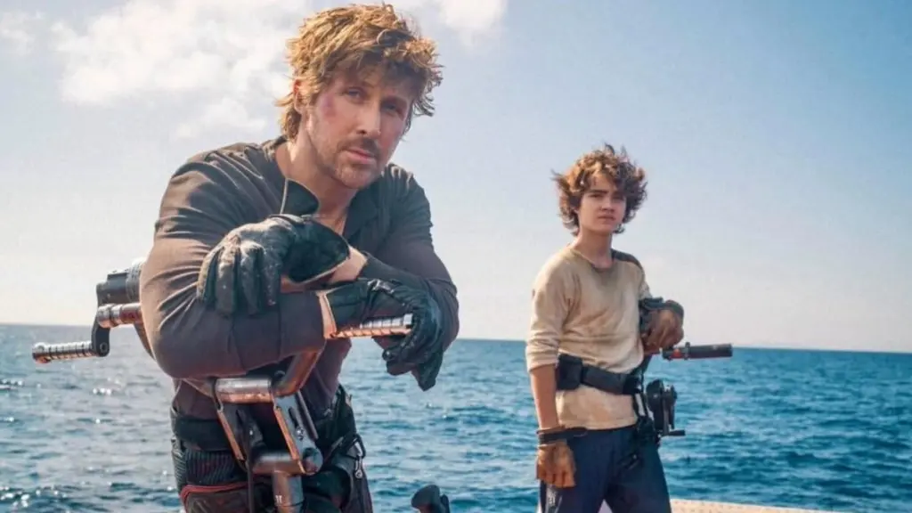 رایان گاسلینگ و یک پسر در جنگ ستارگان: استارفایتر به یکدیگر نگاه می‌کنند.